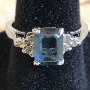 Blue Sapphire surrounded by Cubic zirconia ring